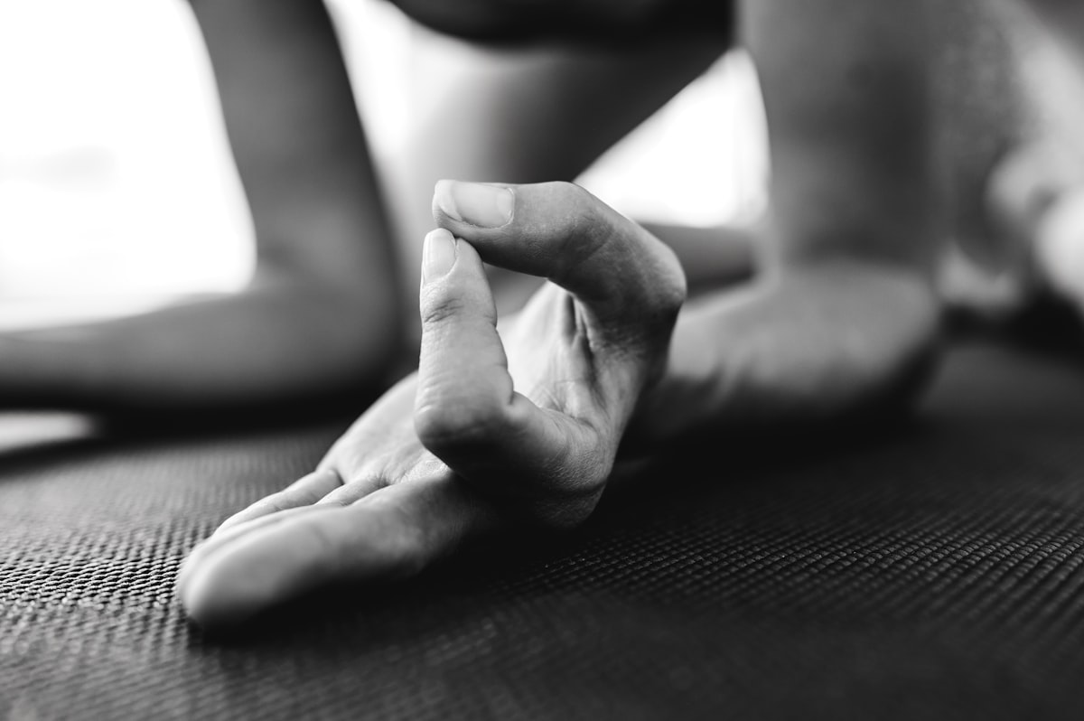 Yoga teacher offering modifications for different abilities